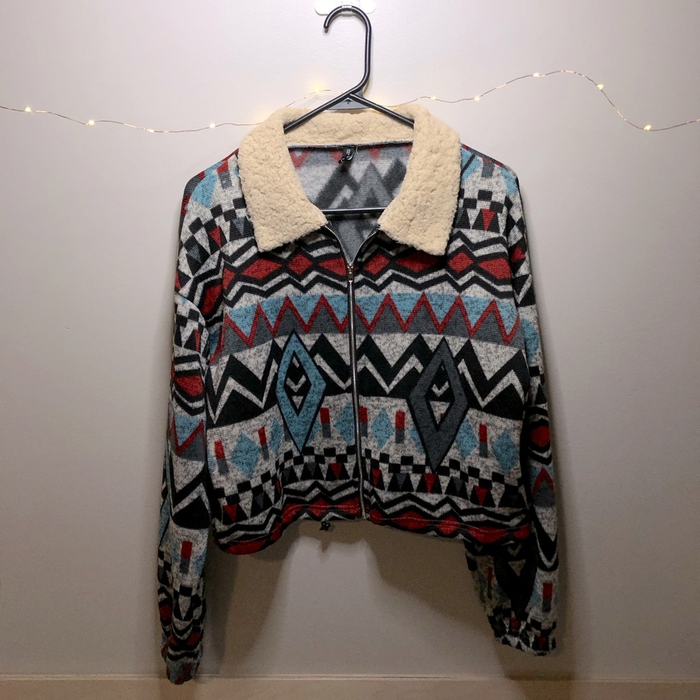 Zip up, sweatshirt. Brand is Zaful. The colors are red, blue, black, and gray.
